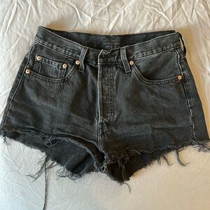 Black Levi’s denim shorts size 28, but run a little small!